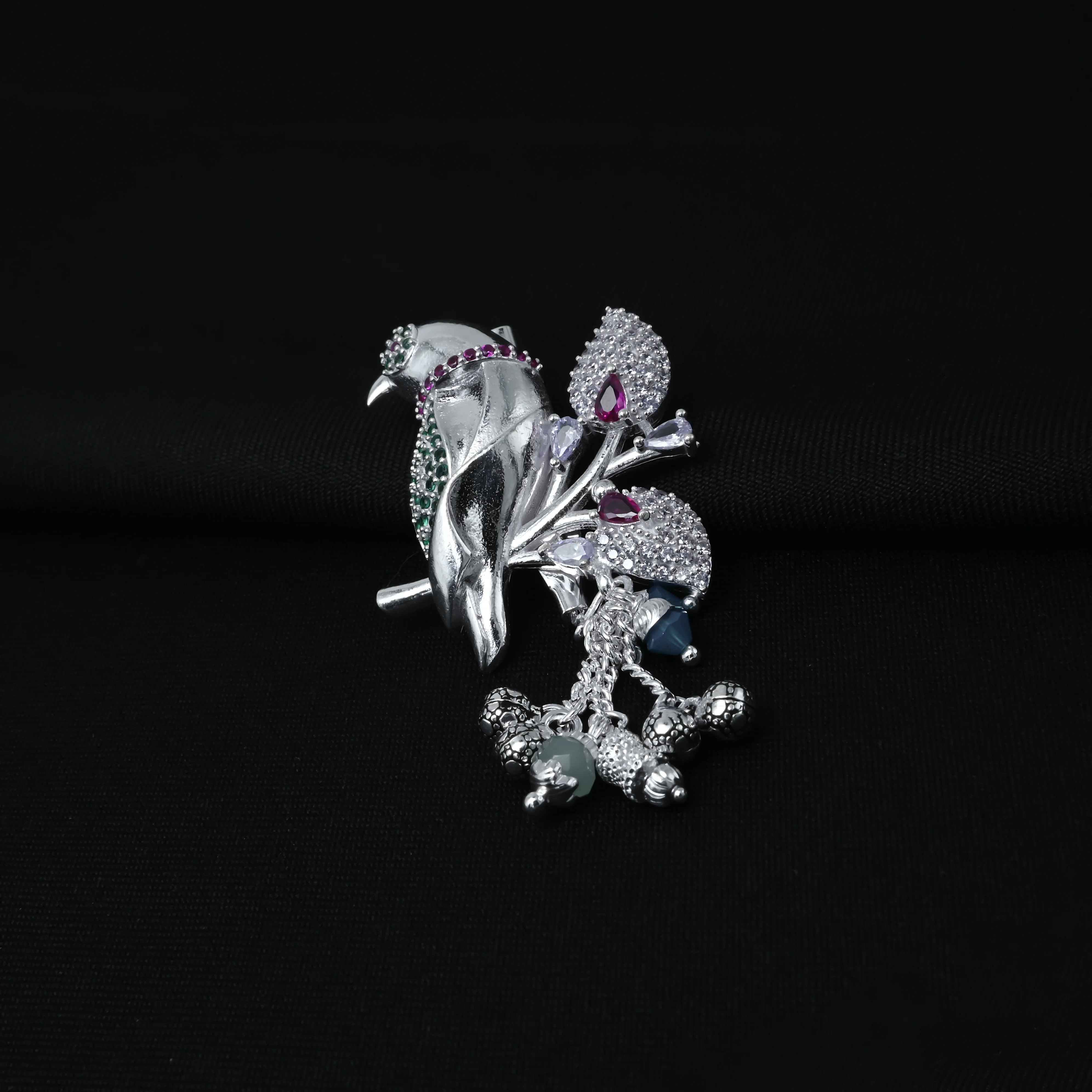 Beautiful Bird Design Silver Saree Pin with Green Purple Stone - Image 2