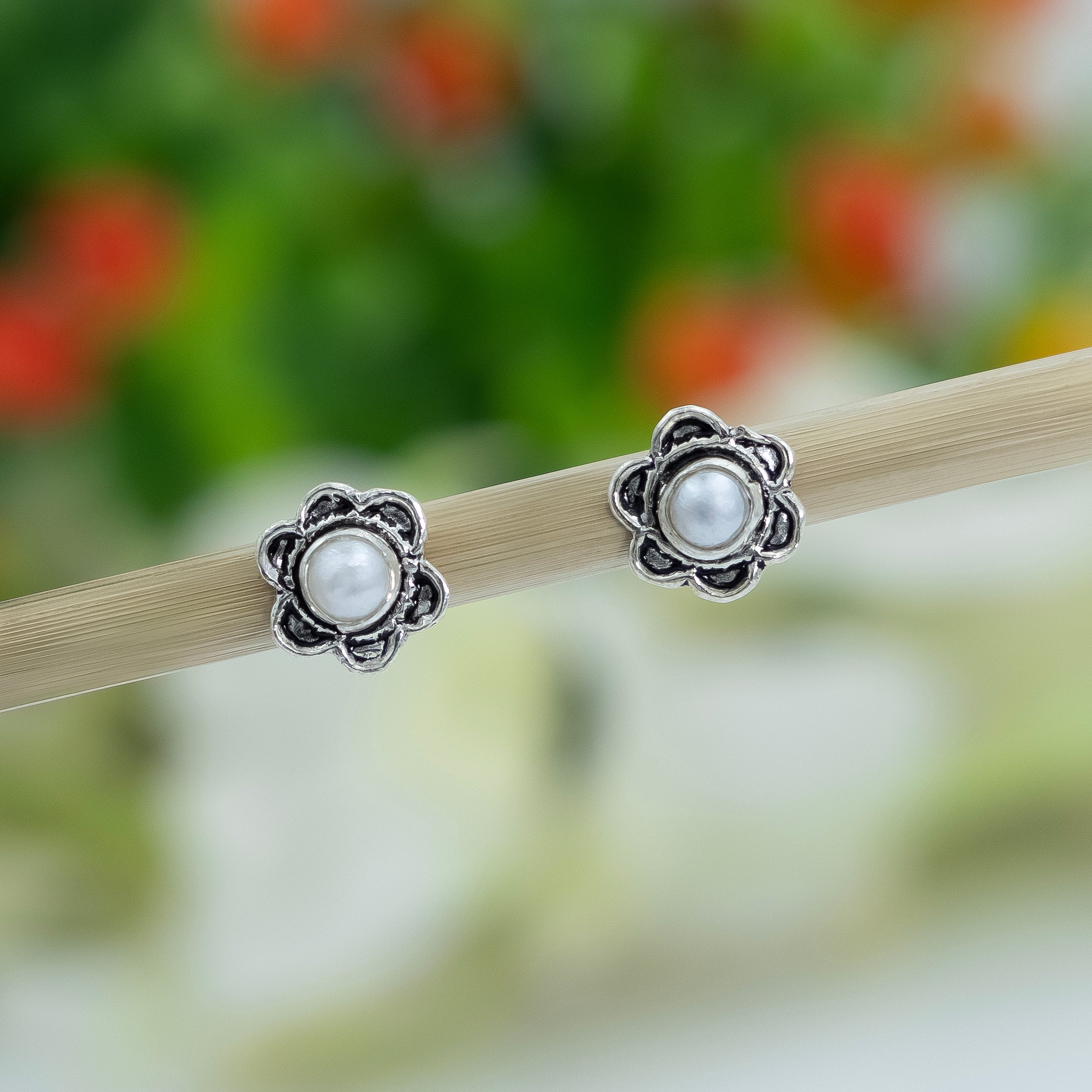 Floral Silver Stud Earrings with Sparkling Stone - Image 3