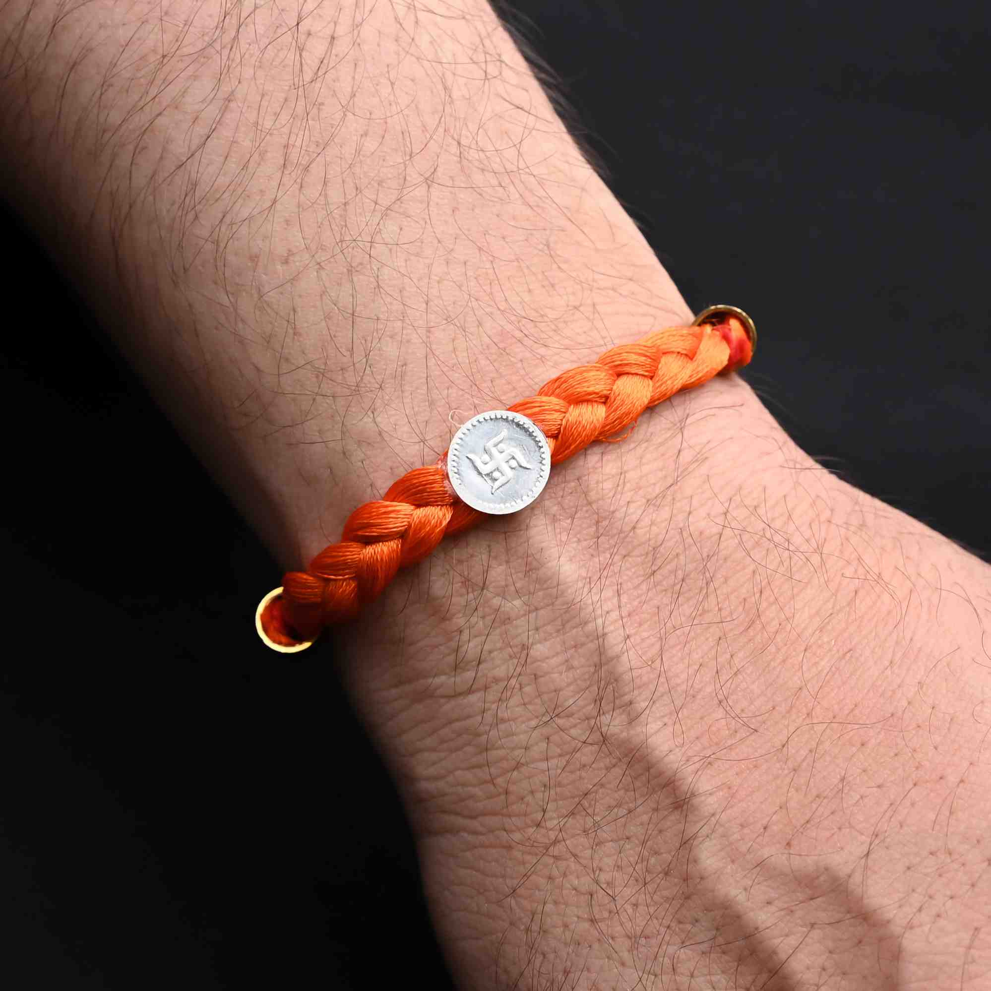 Silver Center Swastika with Orange Tangle Moli Rakhi for Boys - Image 3