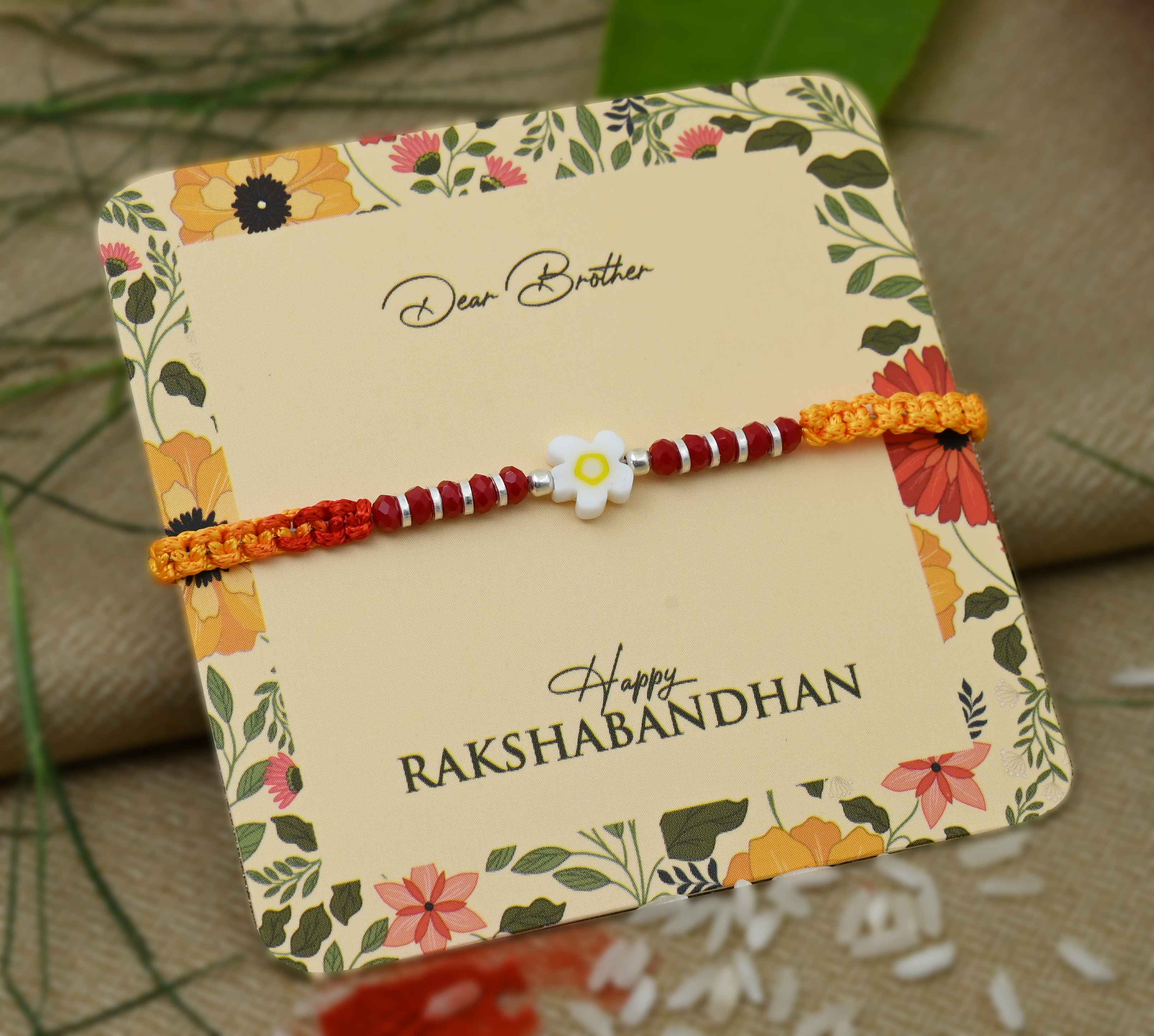 Silver Center White Flower with Silver and Light Red Beads Rakhi for Boys