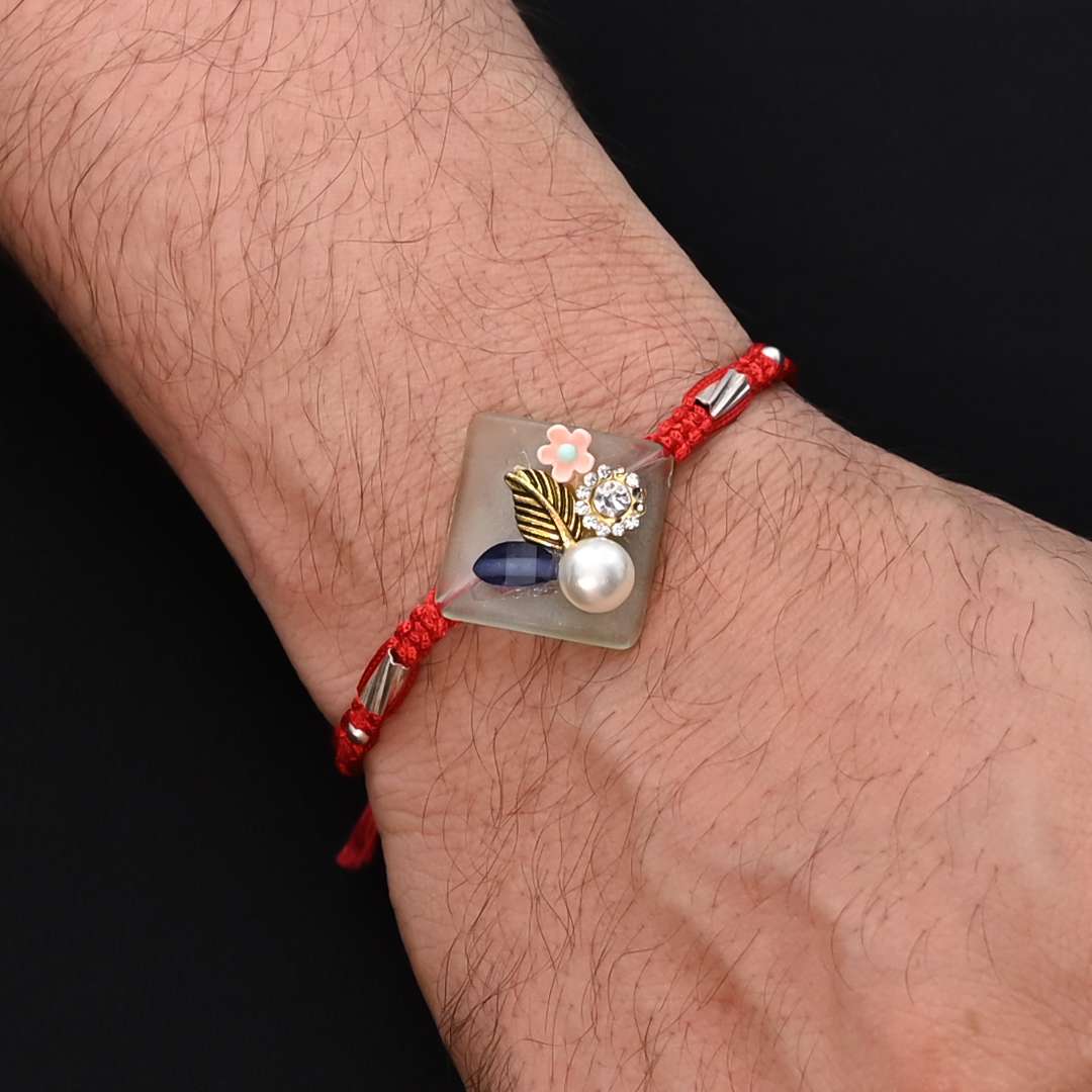 Silver Pearl with Flower Design Rakhi for Boys - Image 3