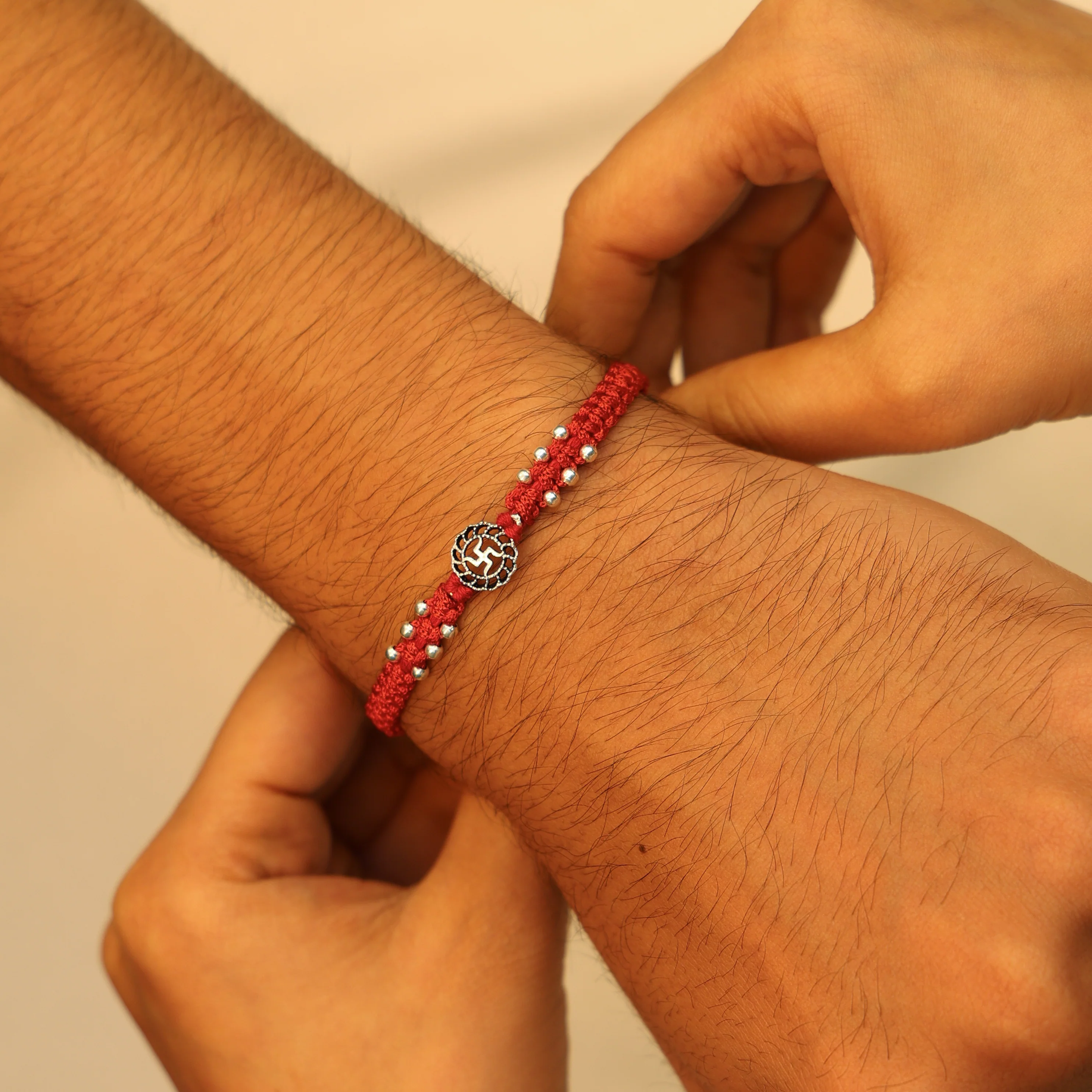 Traditional Swastik Buds Silver Rakhi - Image 4